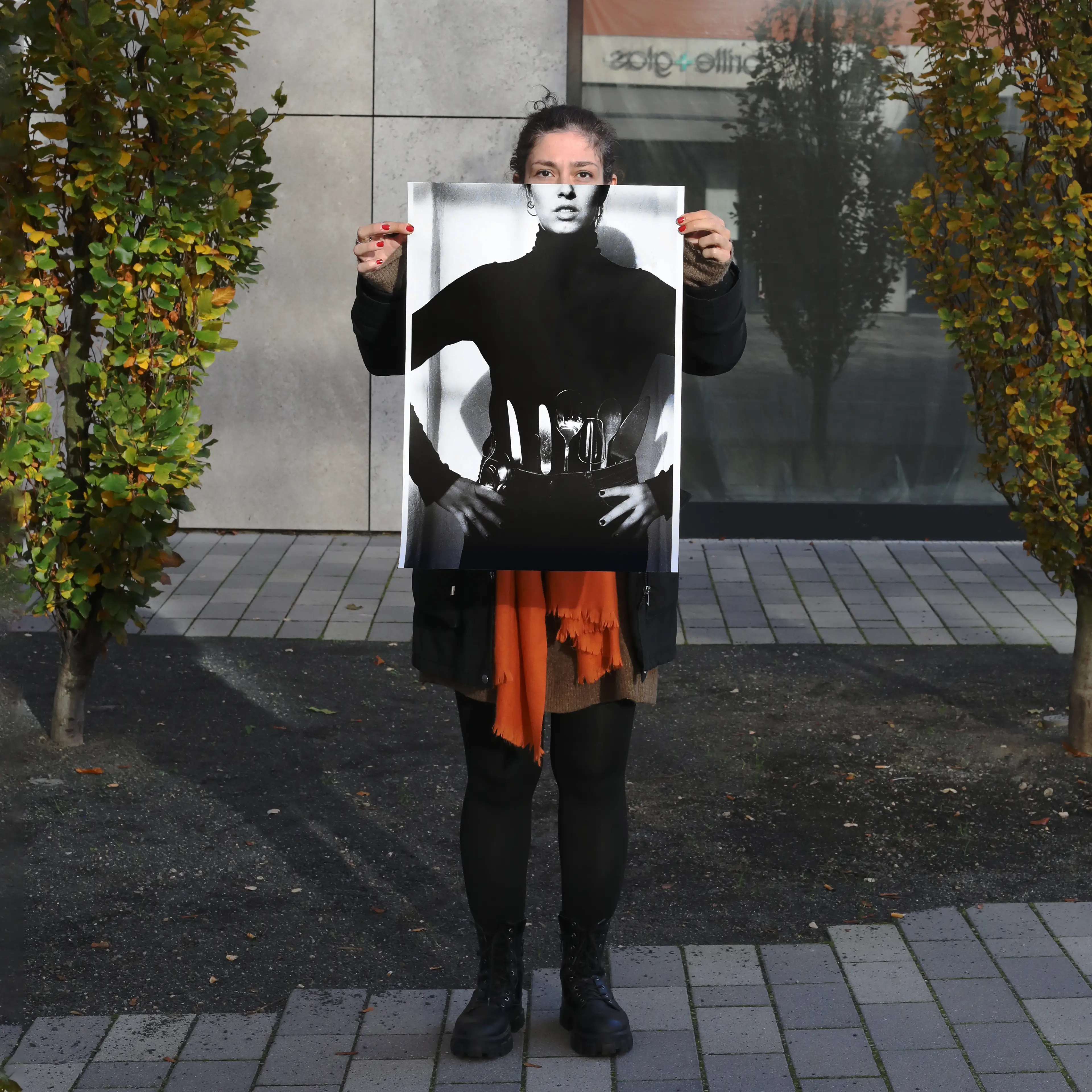 Image of person holding a poster