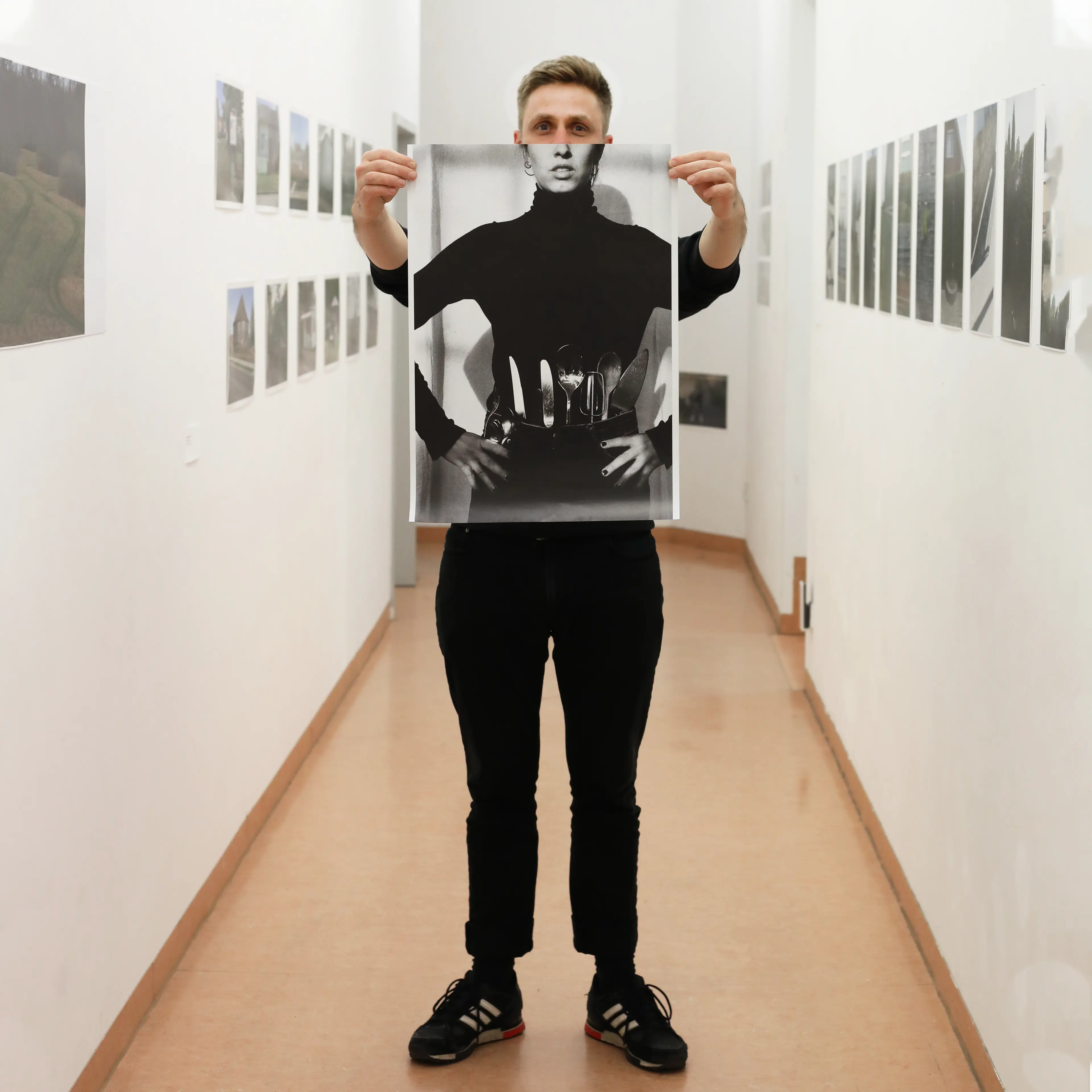 Image of person holding a poster