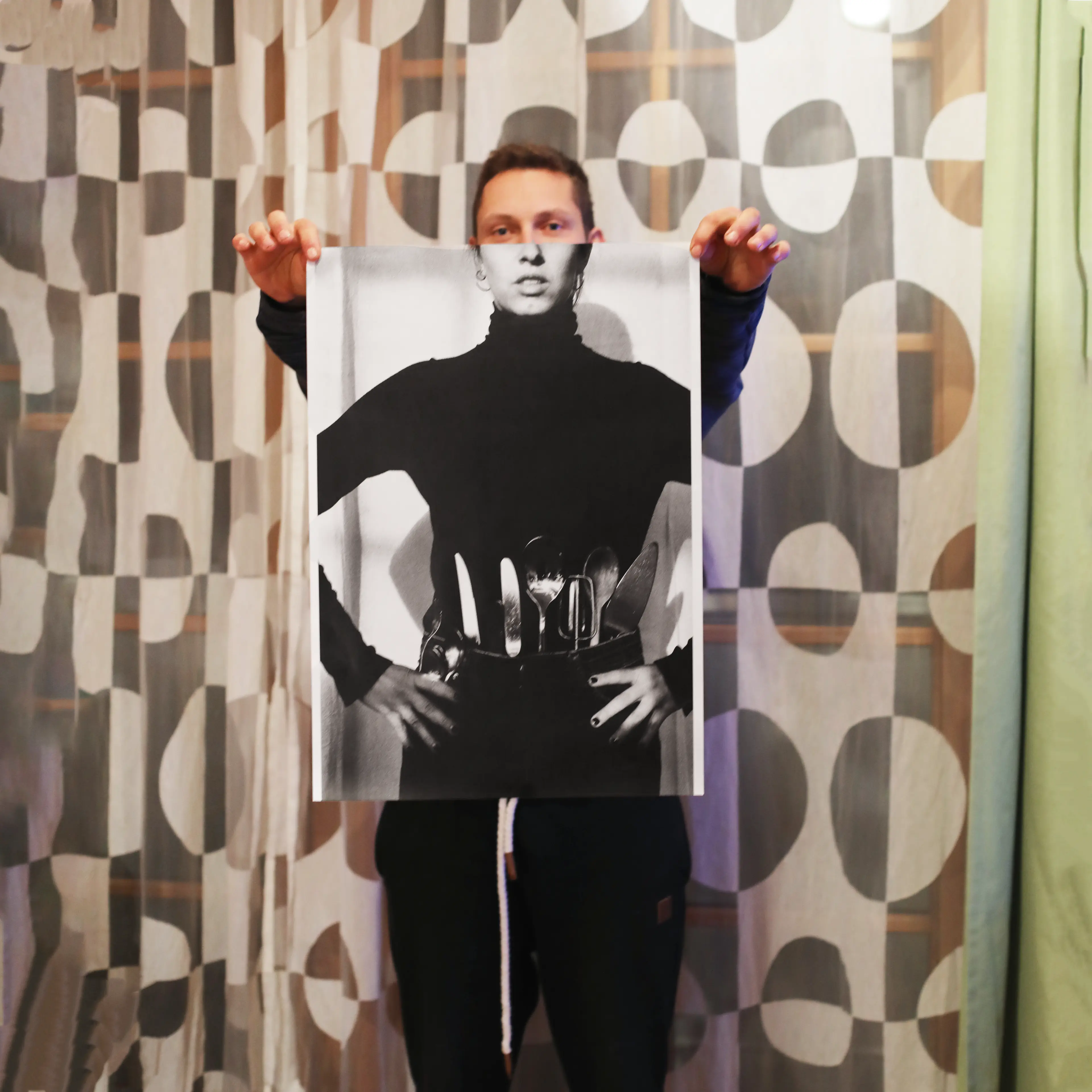 Image of person holding a poster