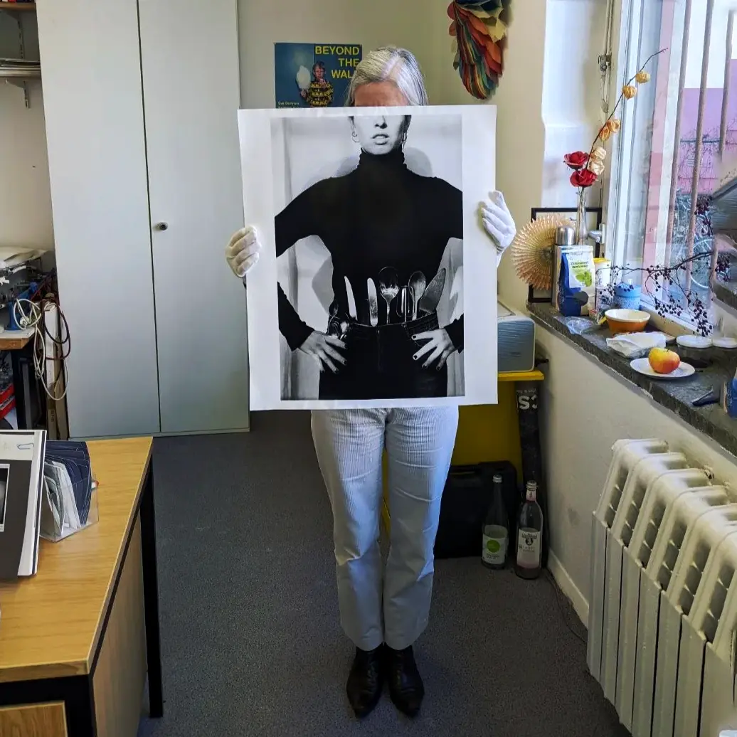 Image of person holding a poster