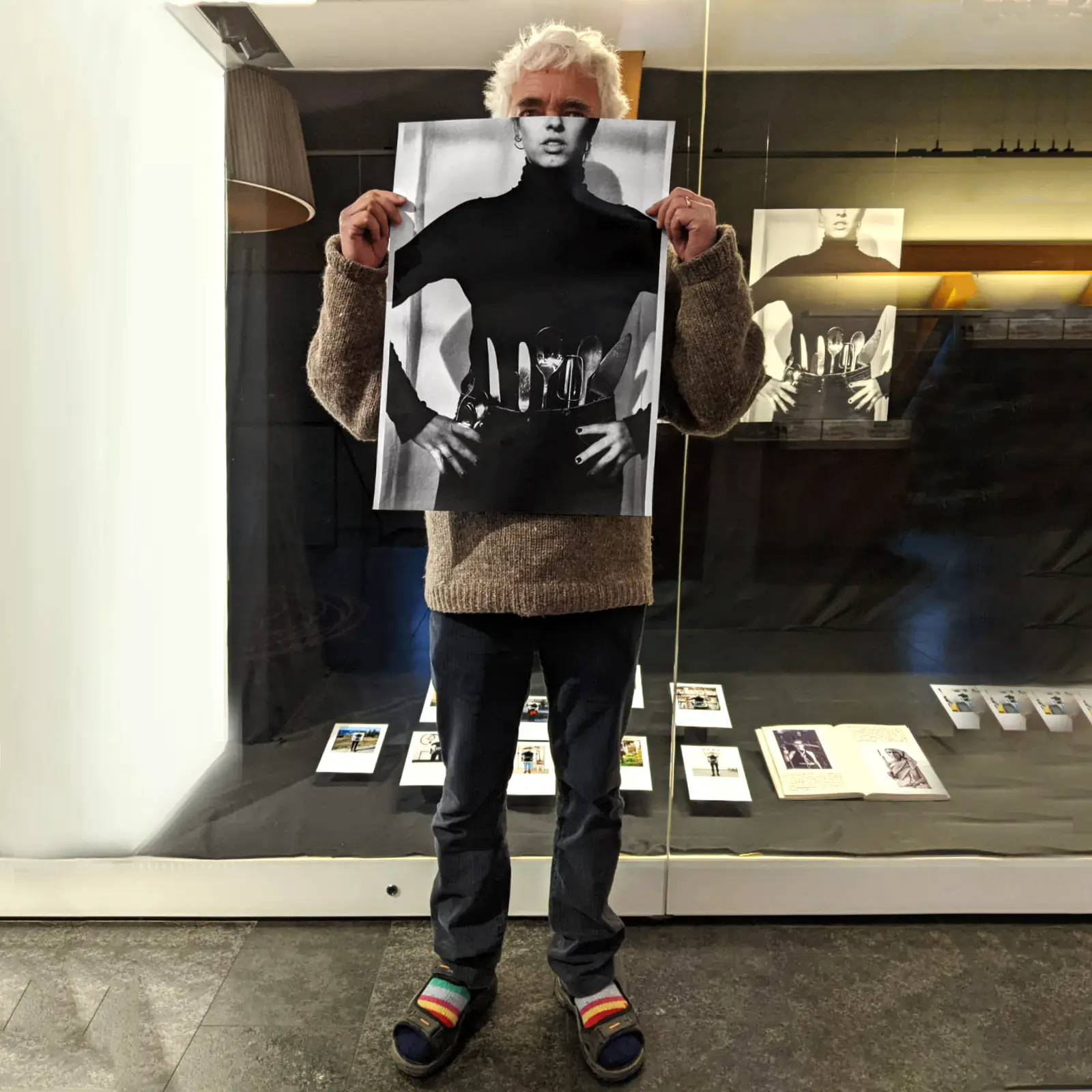 Image of person holding a poster