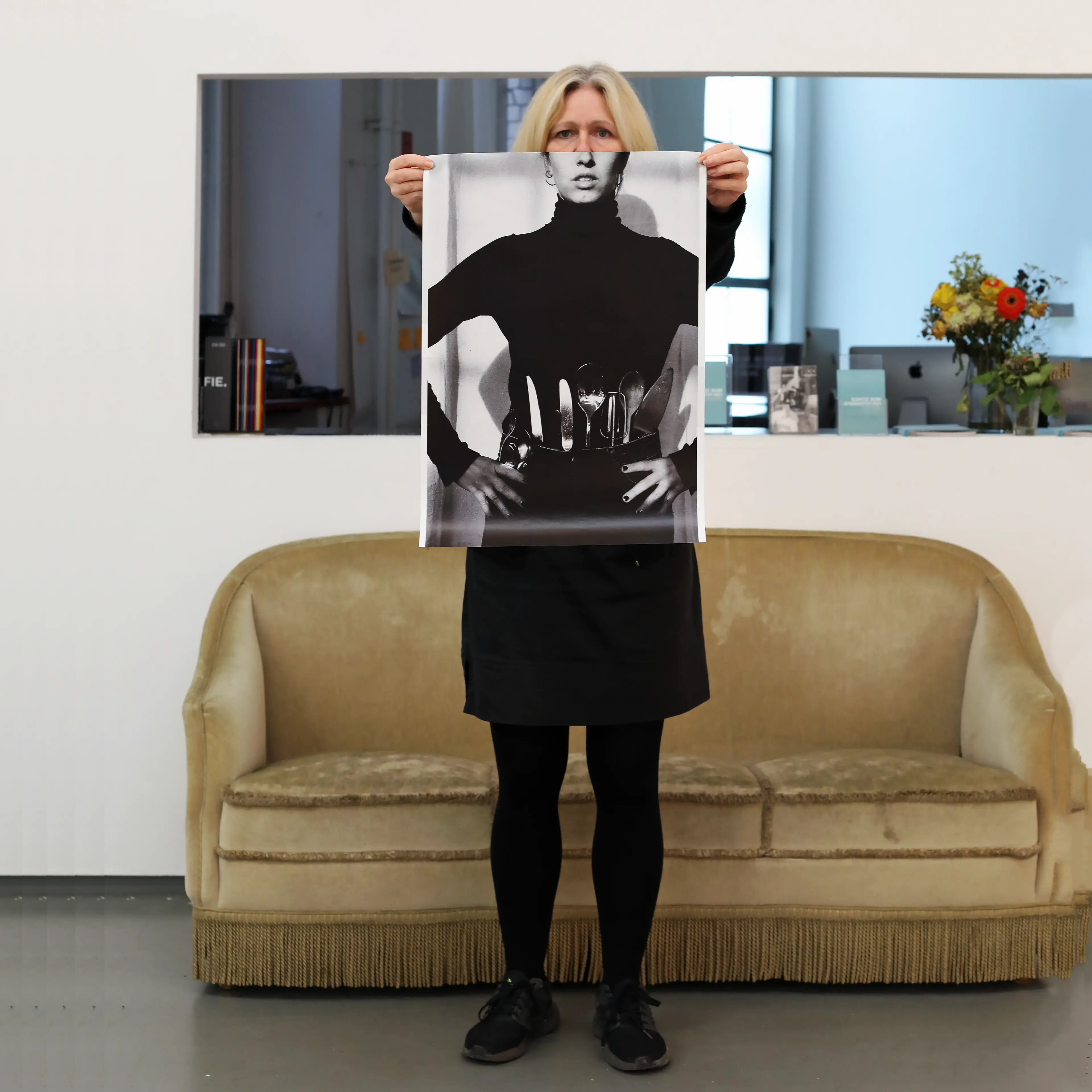 Image of person holding a poster