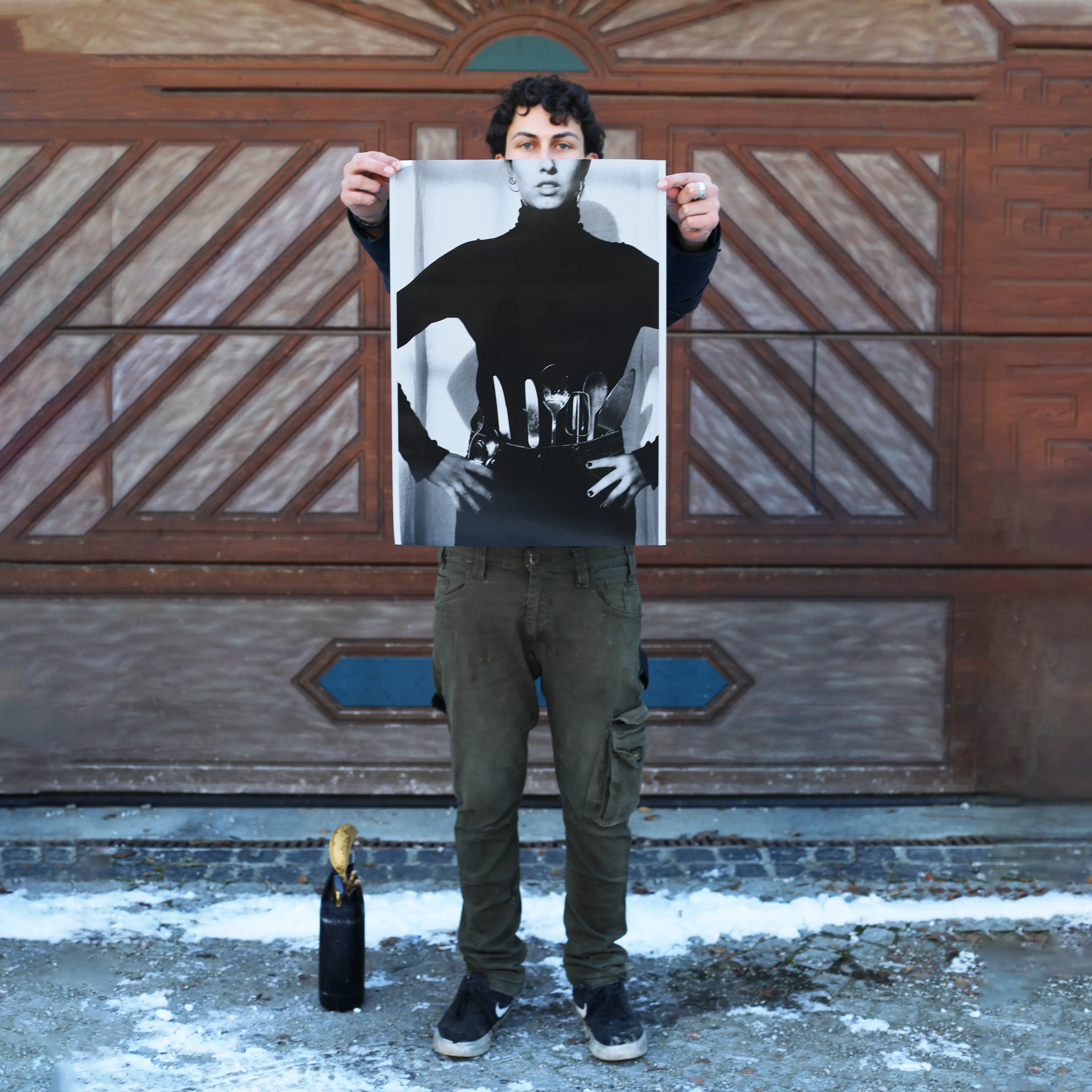 Image of person holding a poster