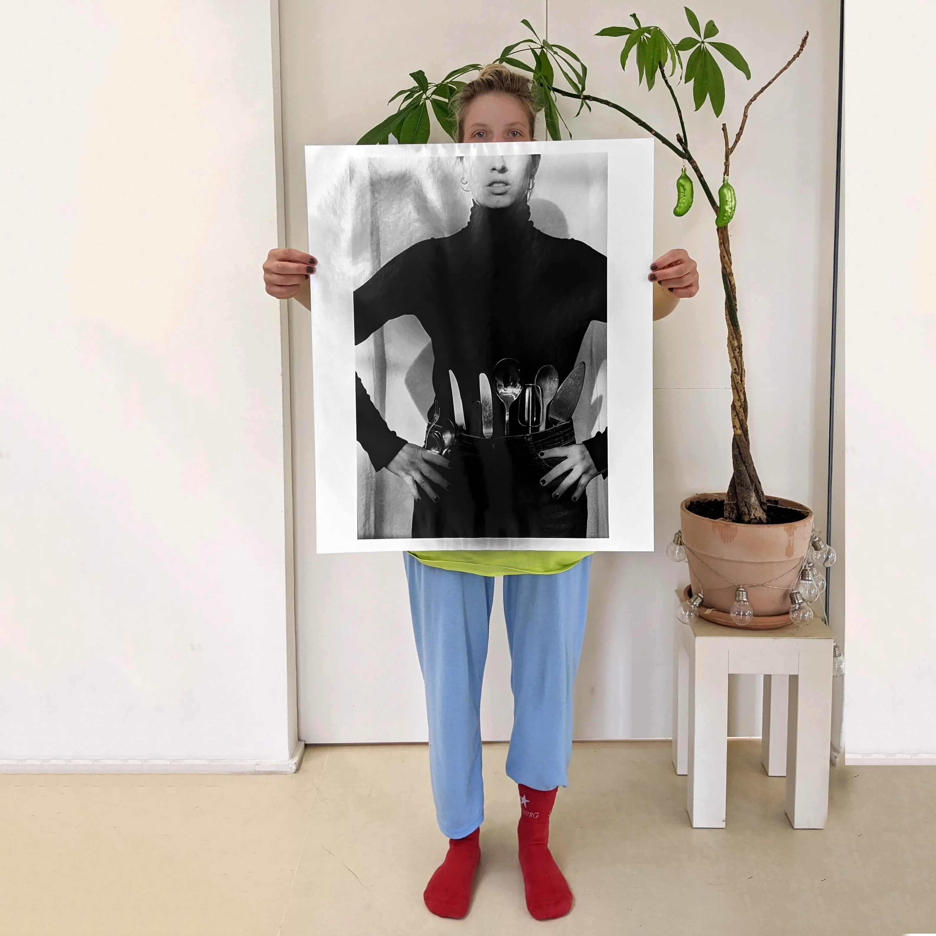Image of person holding a poster