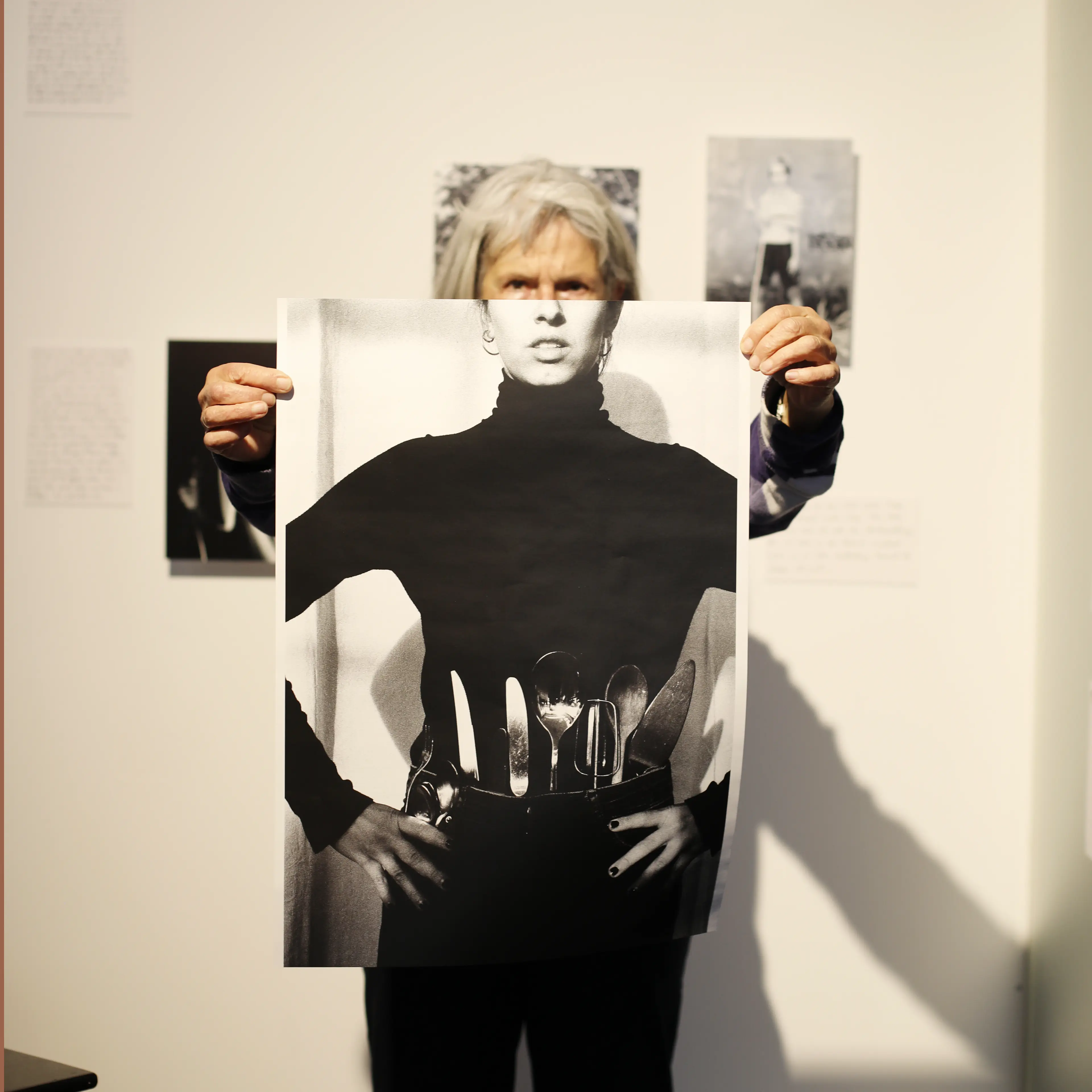 Image of person holding a poster