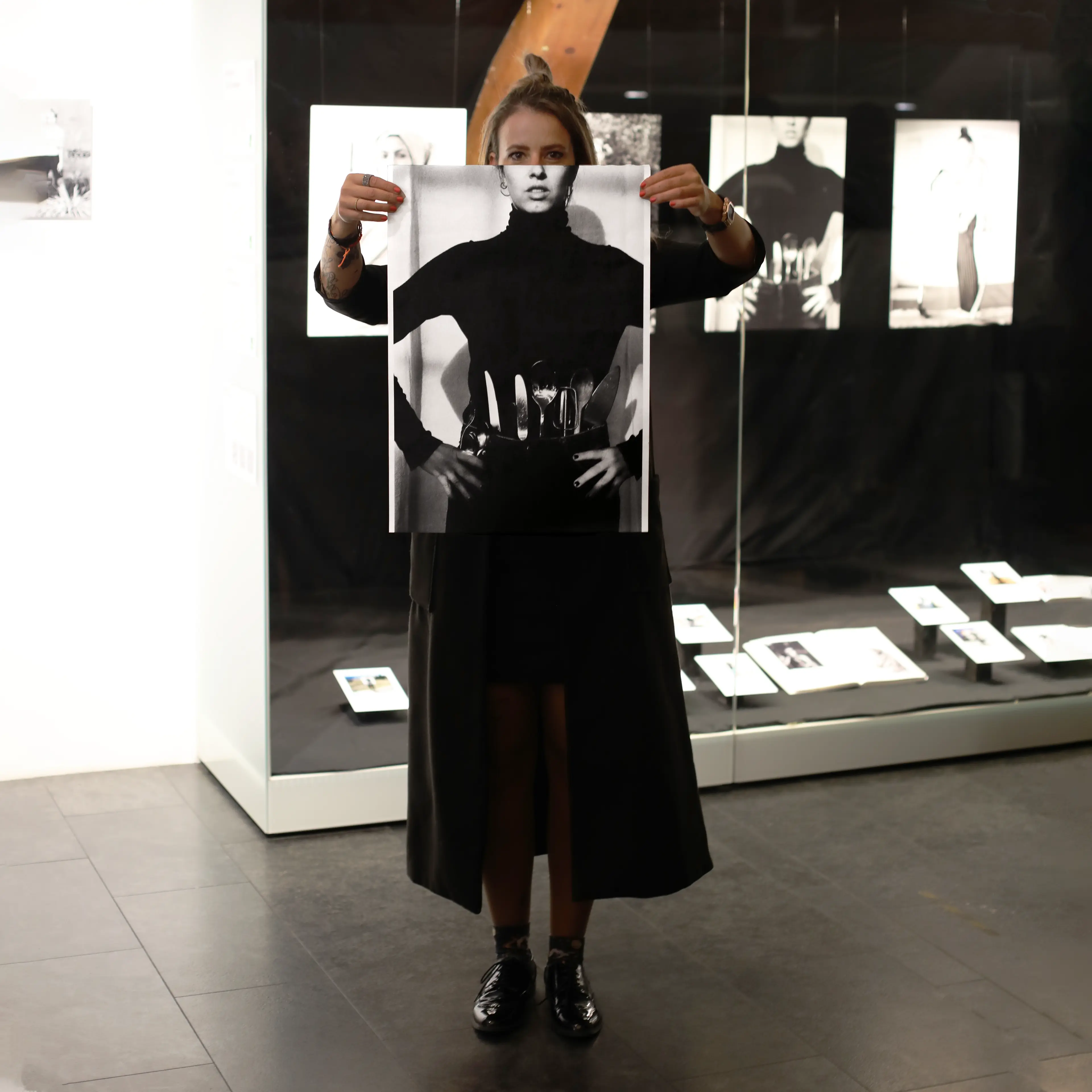 Image of person holding a poster