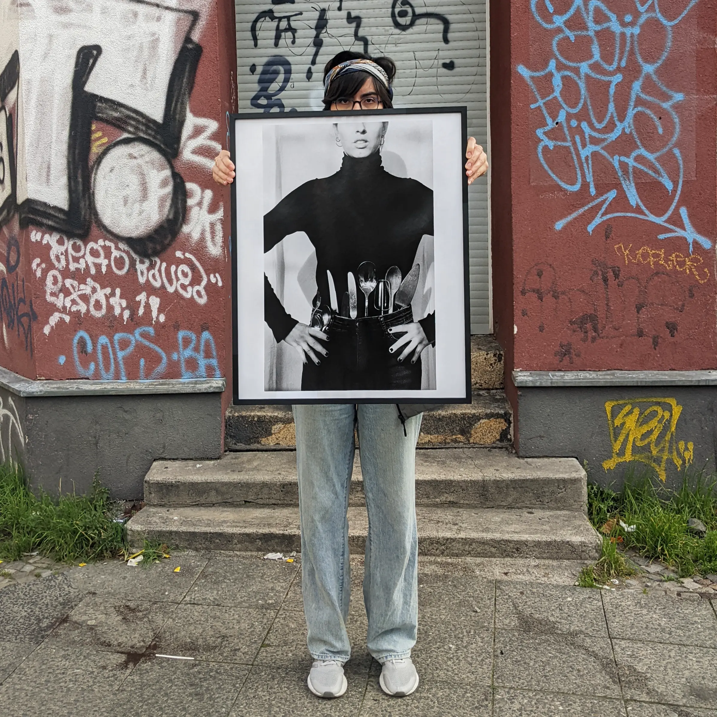 Image of person holding a poster