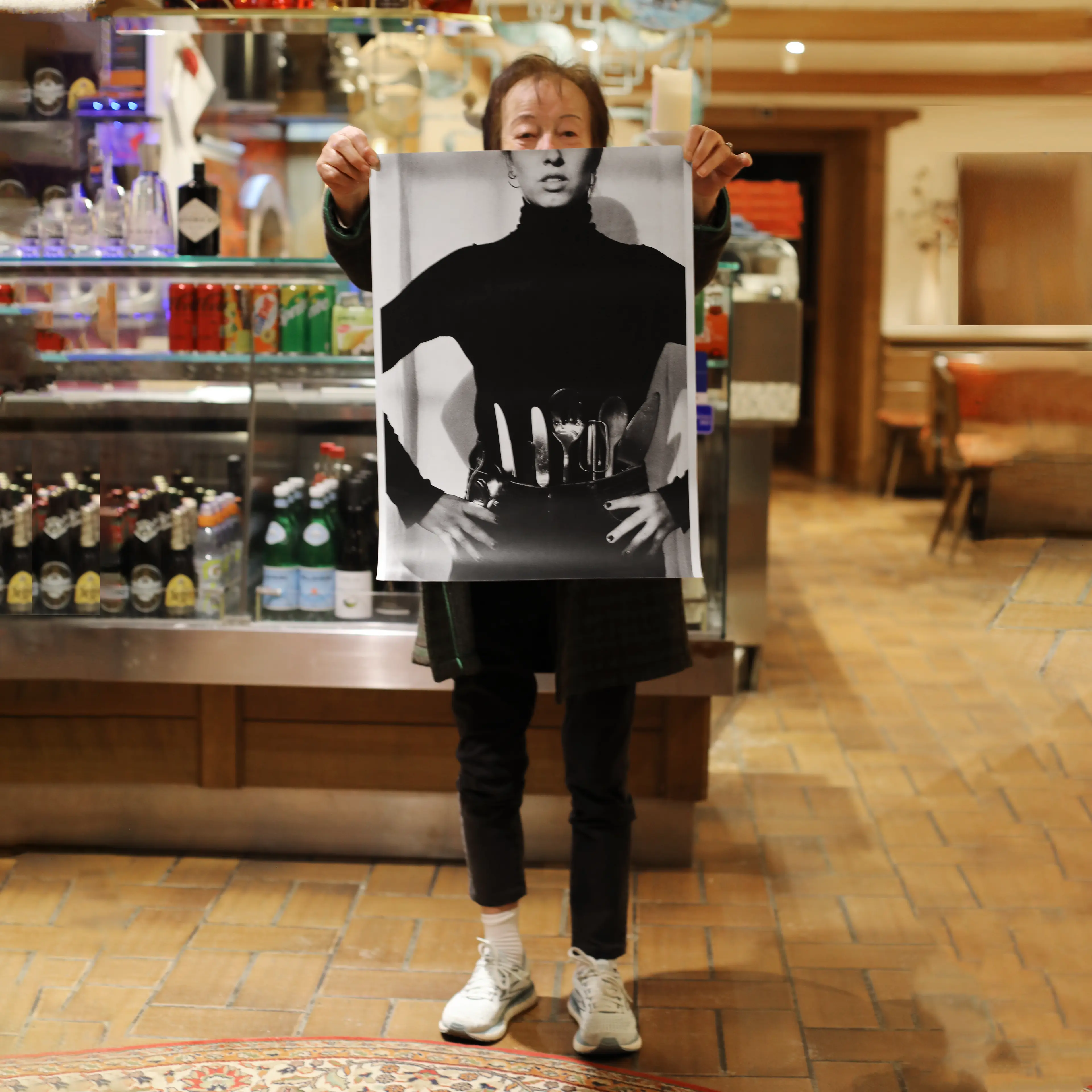 Image of person holding a poster