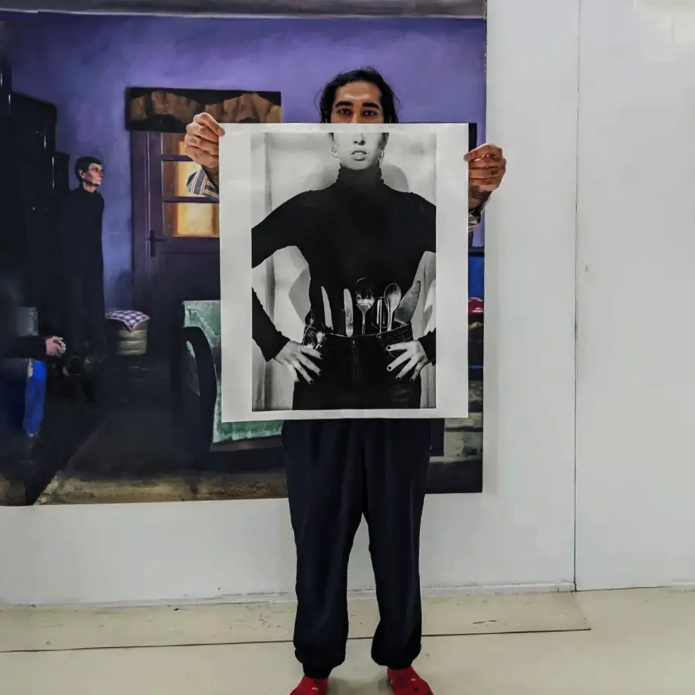 Image of person holding a poster