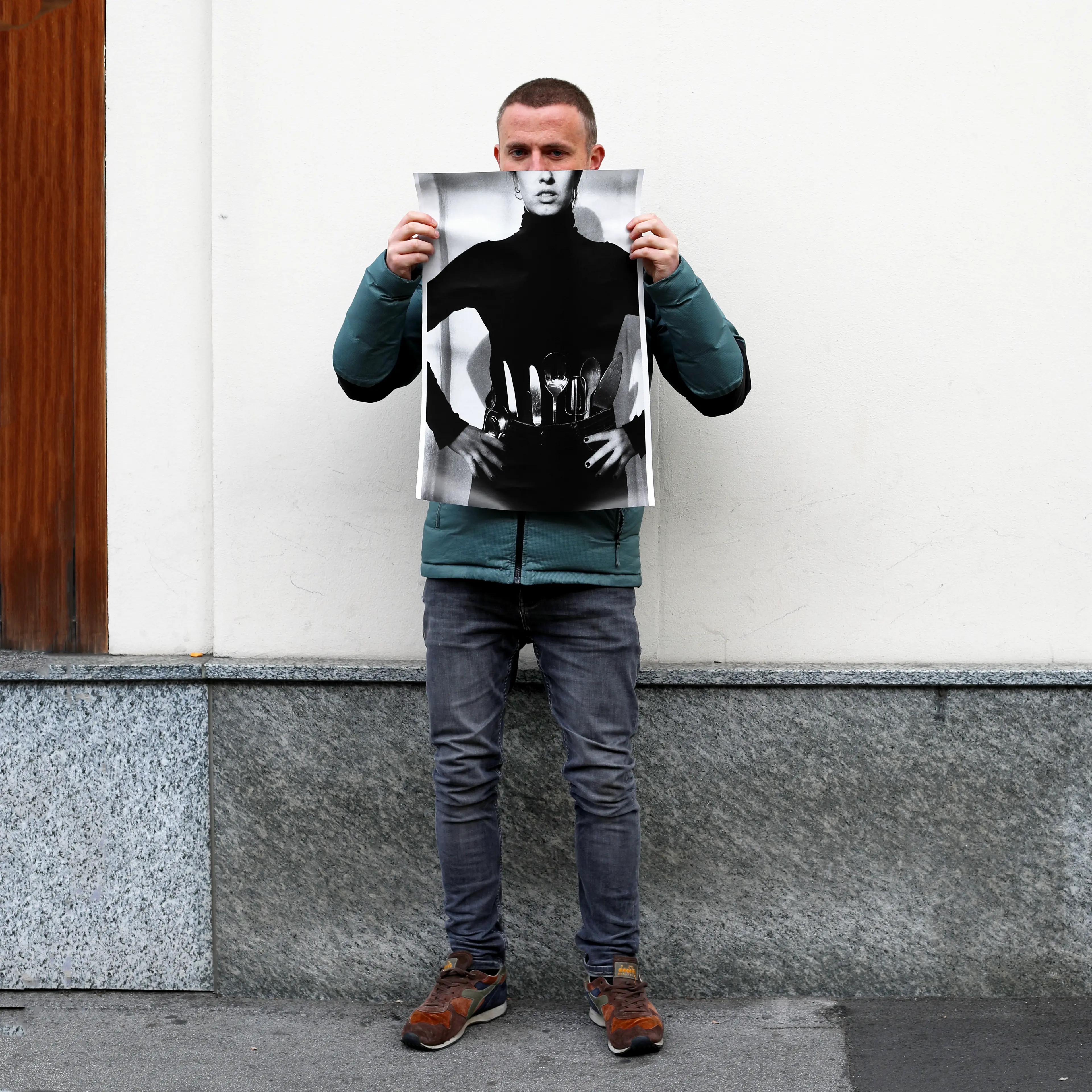 Image of person holding a poster