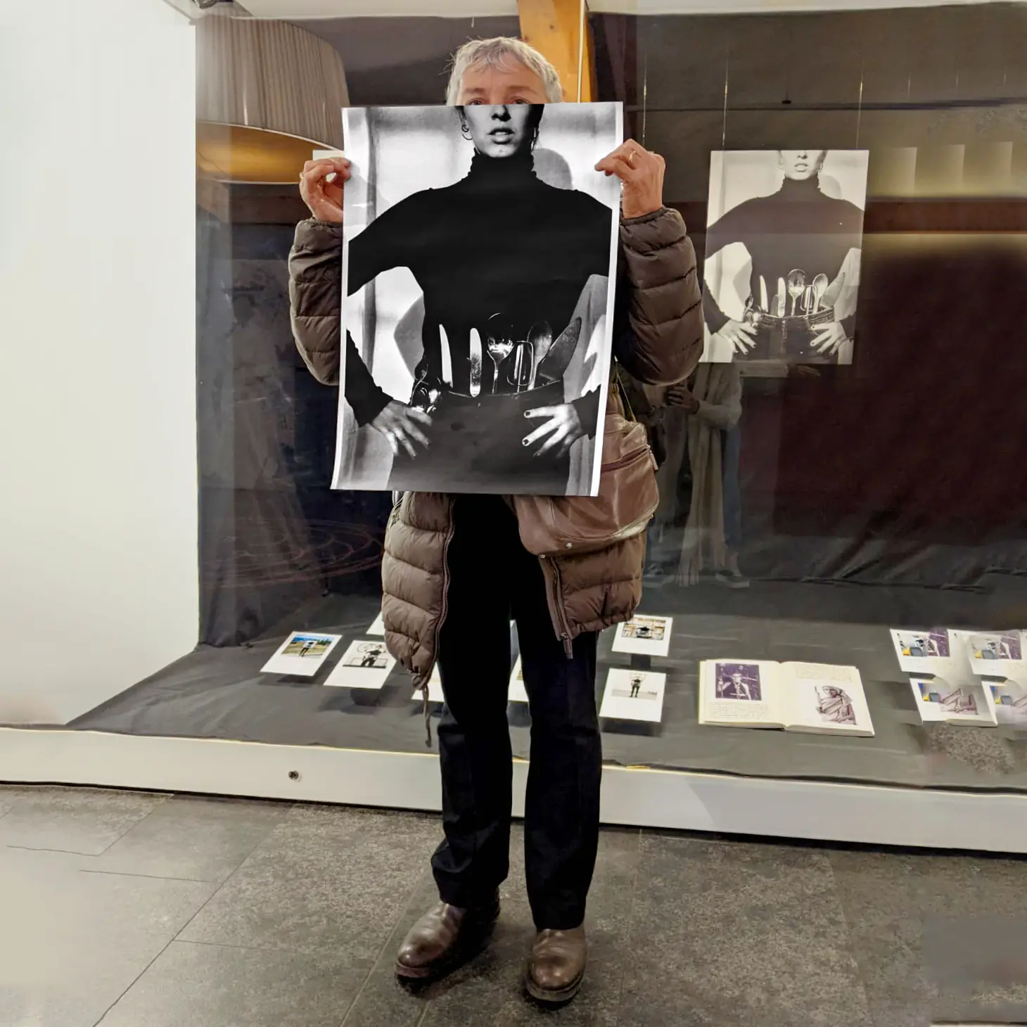 Image of person holding a poster