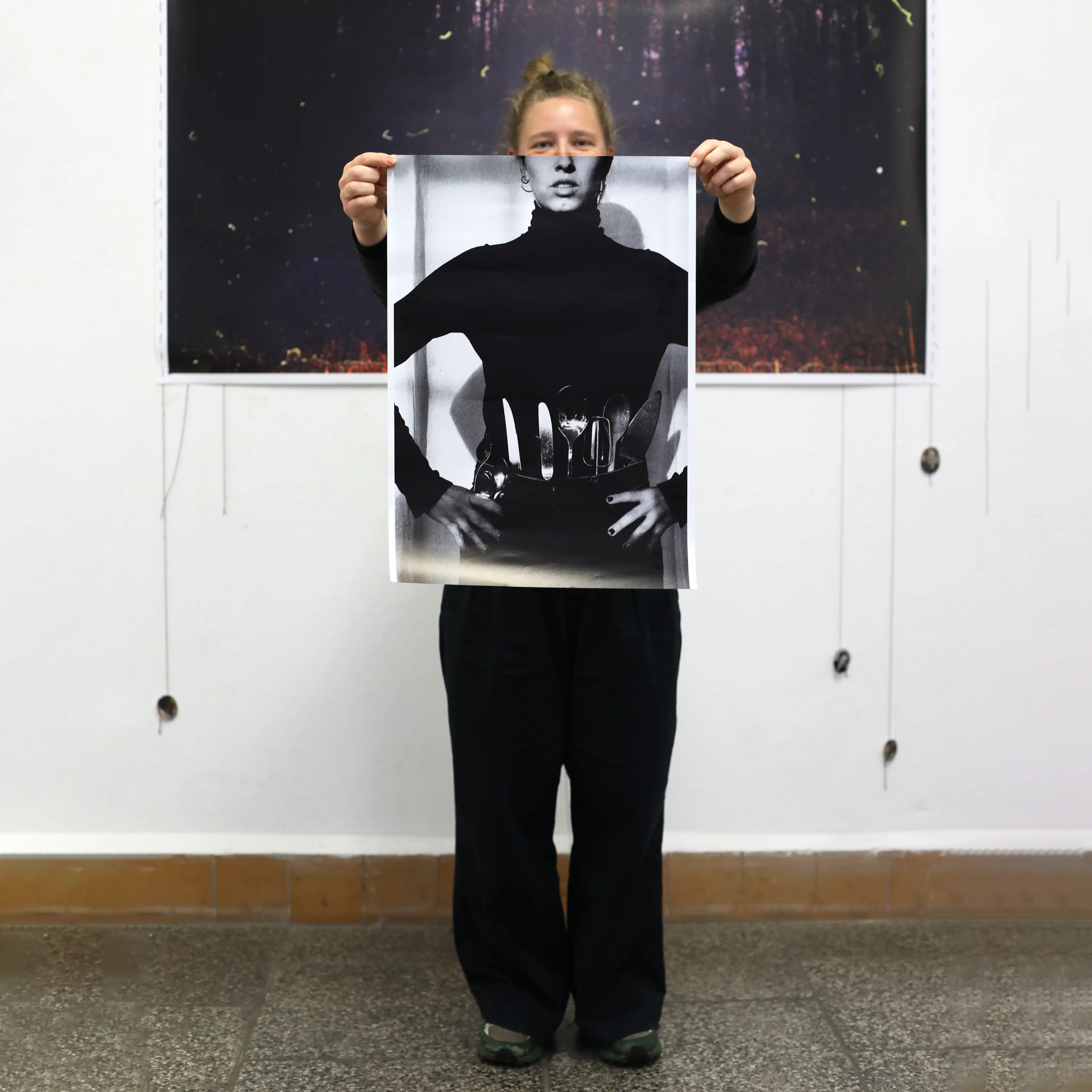 Image of person holding a poster