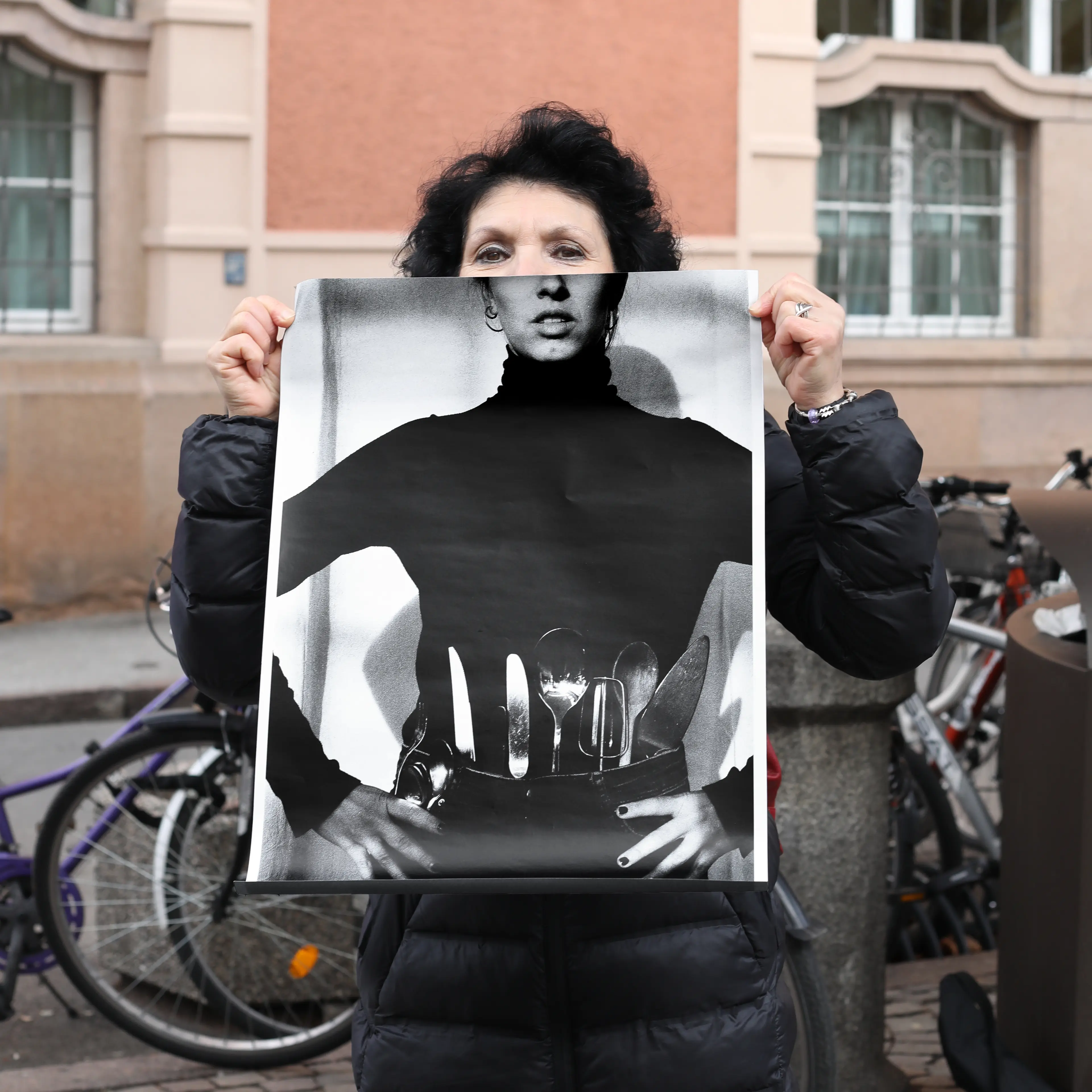 Image of person holding a poster